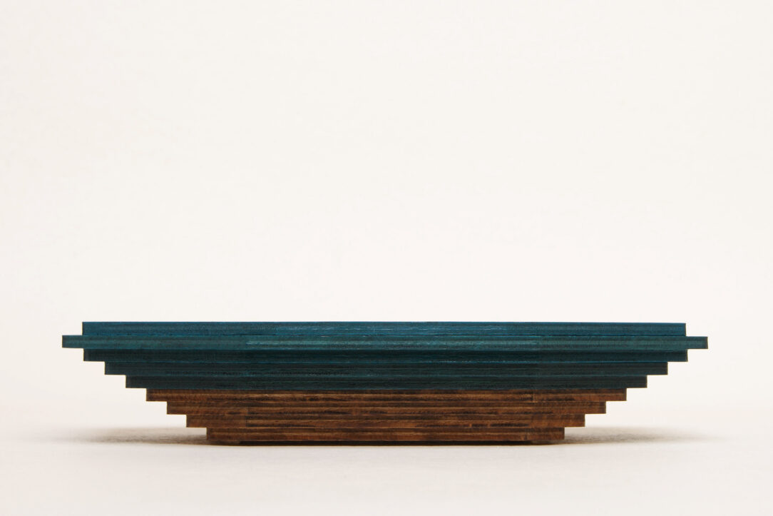 Connected box in bicolor oak wood fashioned by successive layers with double bottom