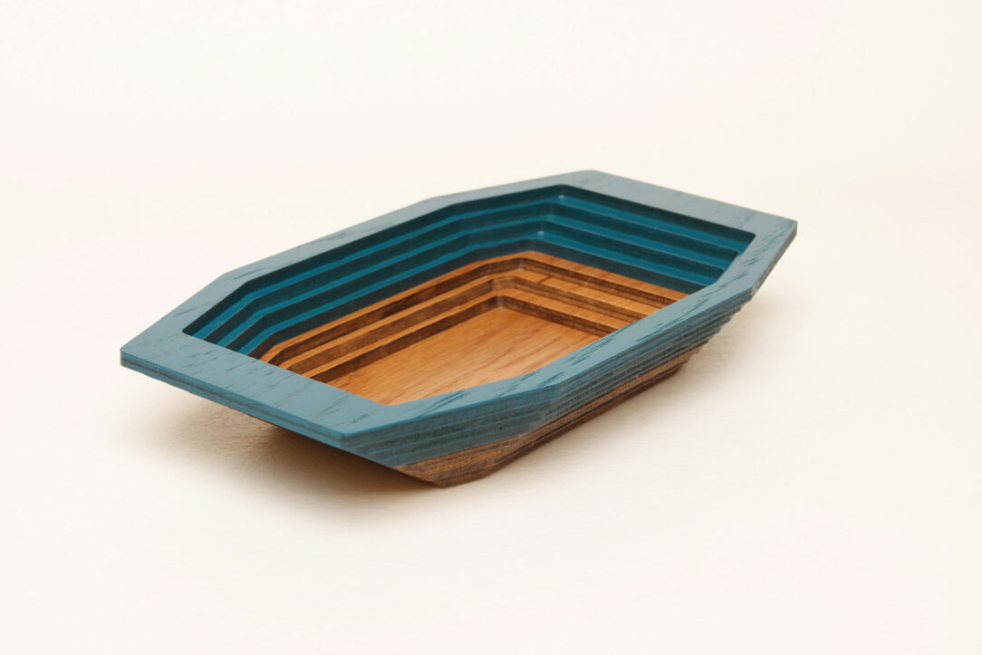 Connected box in bicolor oak wood fashioned by successive layers with double bottom