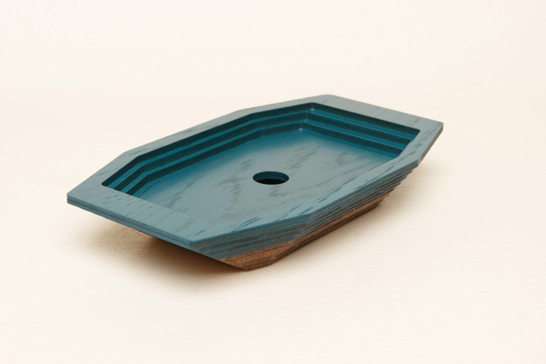 Connected box in bicolor oak wood fashioned by successive layers with double bottom
