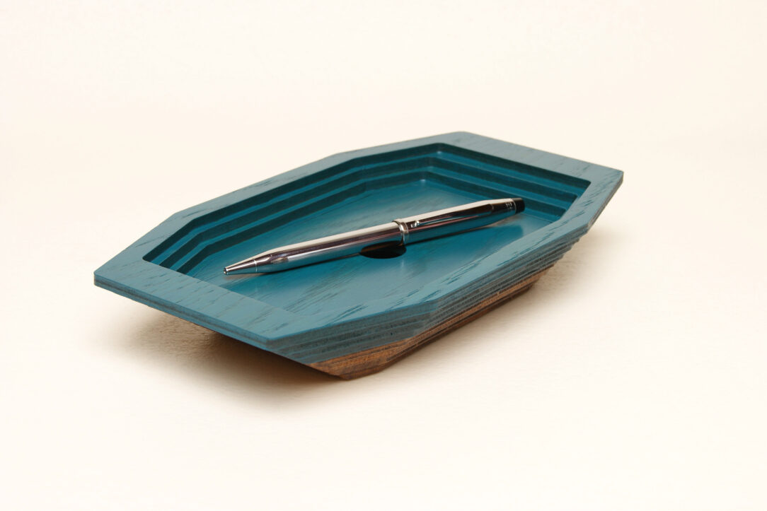 Connected box in bicolor oak wood fashioned by successive layers with double bottom