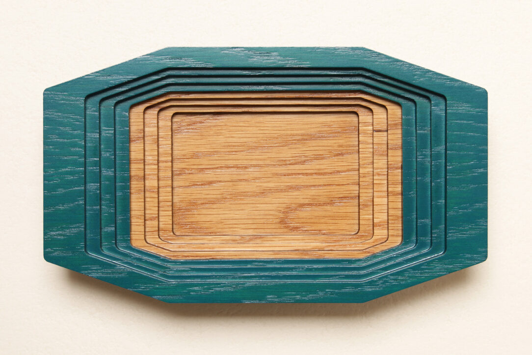 Connected box in bicolor oak wood fashioned by successive layers with double bottom