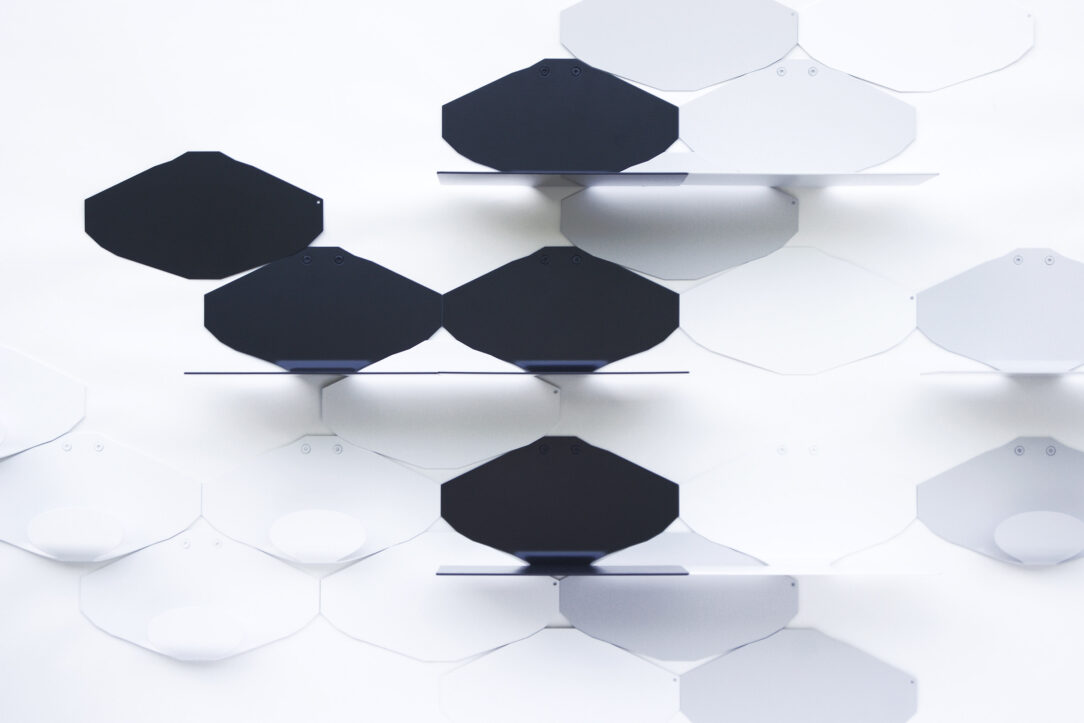 Modern minimalist wall shelves in white and gray lacquered black steel on a white background